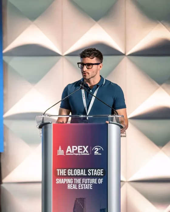 Matthew Schneider giving a keynote at the American Property Expo in Miami, Florida about blockchain technology and real estate tokenization