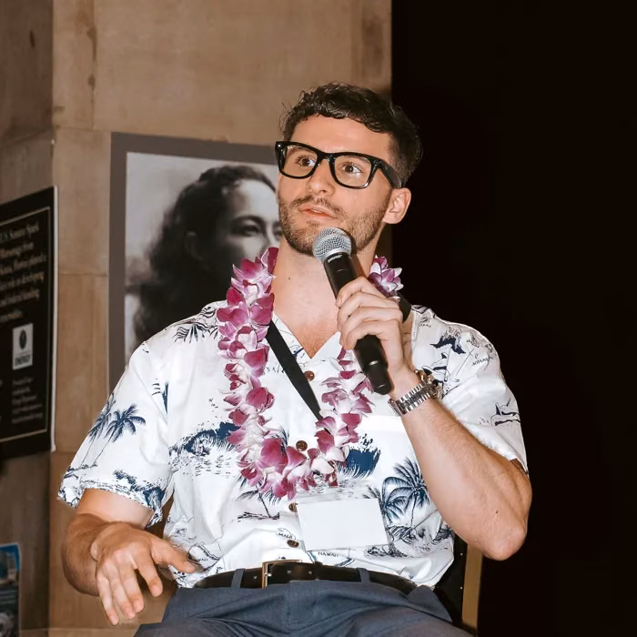 Matthew Schneider speaking at the Pacific Blockchain Summit in Honolulu, Hawaii